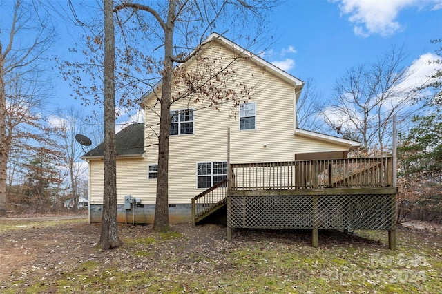 rear view of house featuring a deck