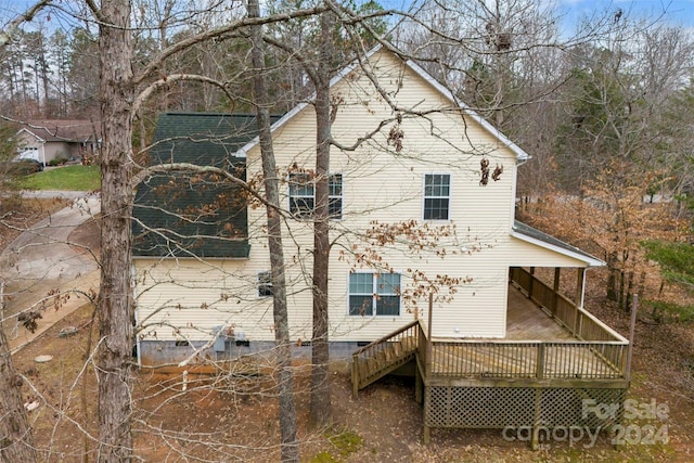 view of home's exterior featuring a wooden deck