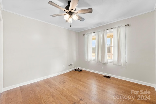 unfurnished room with ceiling fan, light hardwood / wood-style floors, and ornamental molding