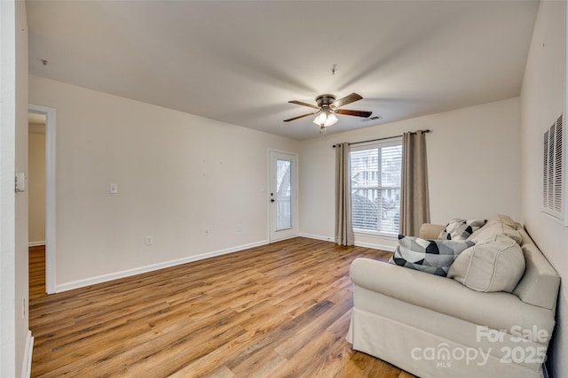 sitting room featuring ceiling fan and light hardwood / wood-style flooring