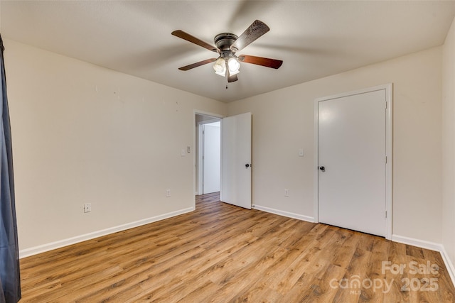 unfurnished bedroom featuring light hardwood / wood-style flooring and ceiling fan