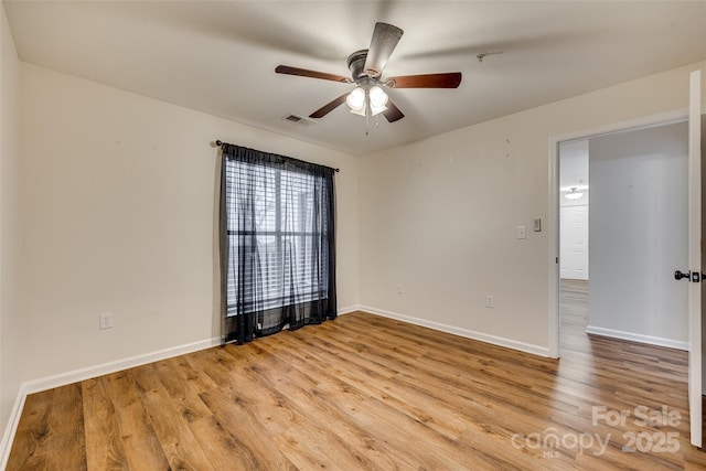 spare room featuring ceiling fan and light hardwood / wood-style flooring