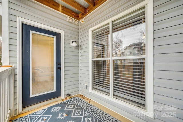 doorway to property featuring a porch