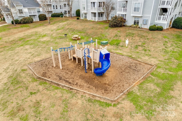 view of jungle gym featuring a lawn