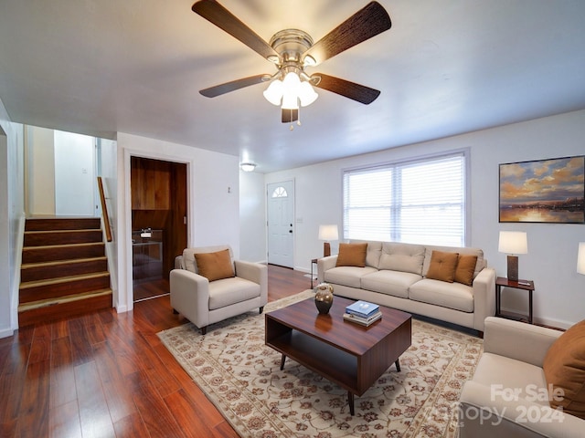 living room featuring hardwood / wood-style flooring and ceiling fan