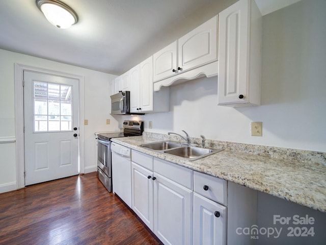 kitchen featuring sink, white cabinets, dark wood-type flooring, and appliances with stainless steel finishes