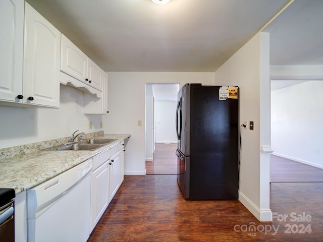 kitchen featuring white cabinetry, light stone countertops, dark hardwood / wood-style floors, white dishwasher, and black refrigerator