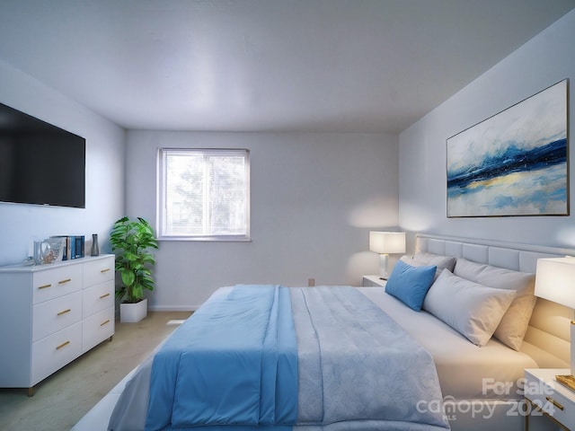 bedroom featuring light colored carpet