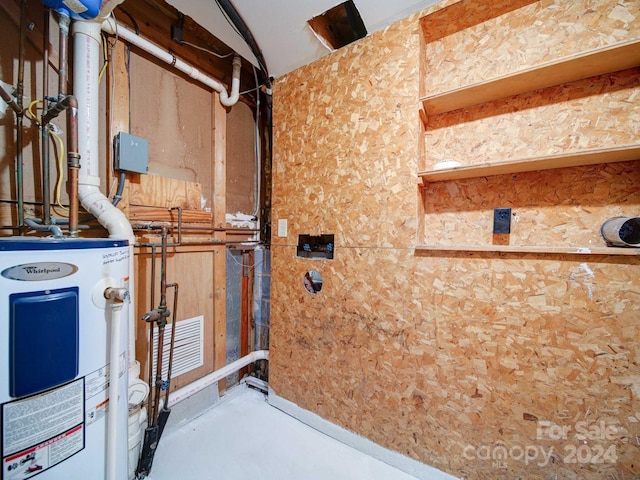 utility room with electric water heater