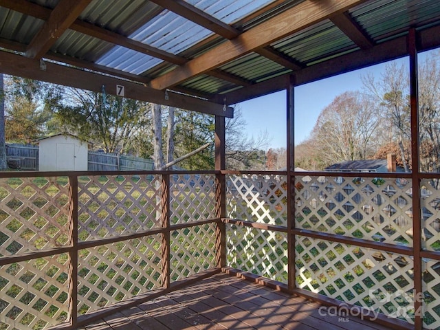 wooden terrace with a storage unit