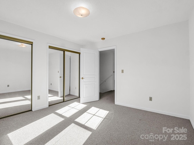 unfurnished bedroom with light carpet