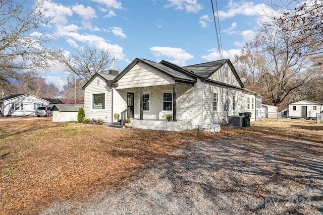 view of front facade with central AC unit and covered porch