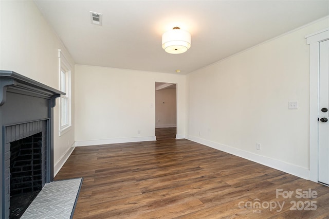 unfurnished living room featuring dark wood-type flooring