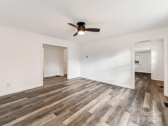 unfurnished room featuring ceiling fan and dark hardwood / wood-style floors