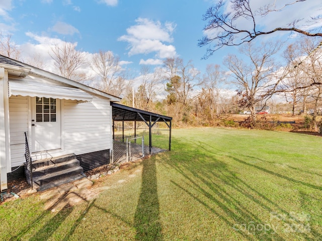 view of yard featuring a carport