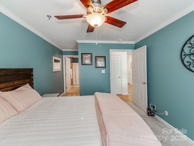 bedroom featuring light carpet, ceiling fan, and crown molding