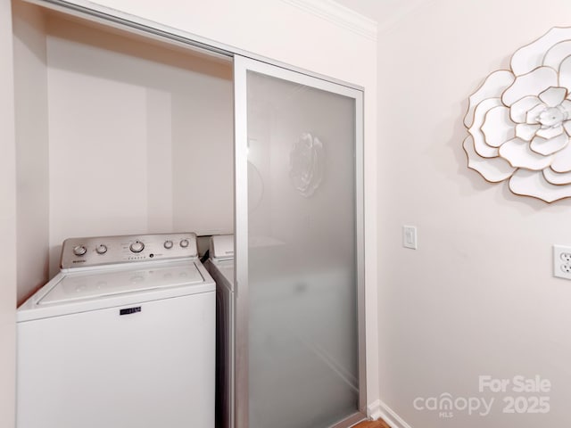 washroom featuring washer / clothes dryer and crown molding