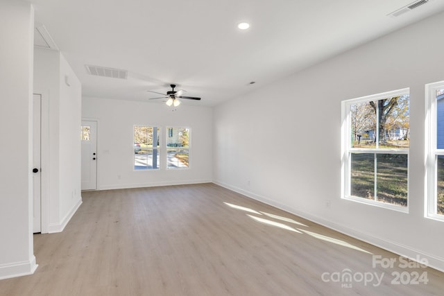 unfurnished room featuring ceiling fan and light hardwood / wood-style floors