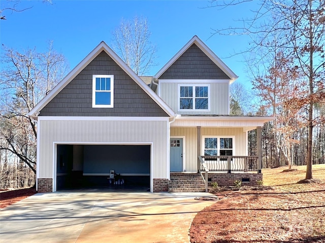 craftsman house with a porch and a garage