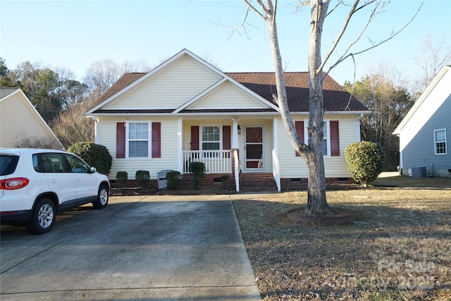 view of front of home with central air condition unit and covered porch