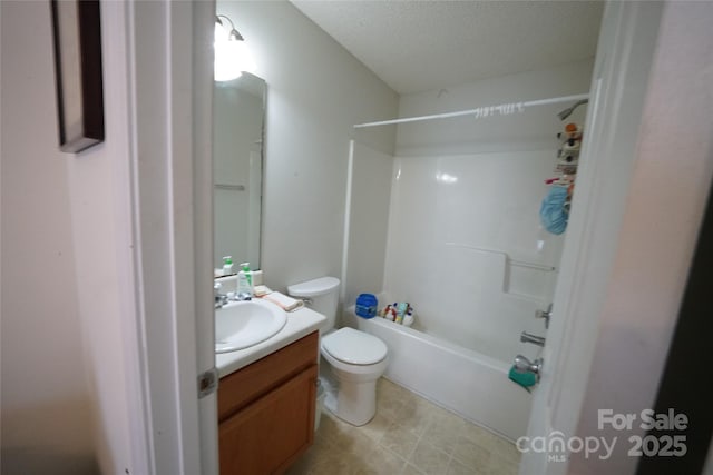 full bathroom featuring toilet, vanity, a textured ceiling, and washtub / shower combination