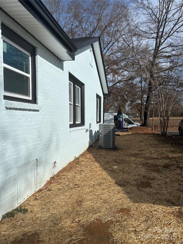 view of side of home with cooling unit