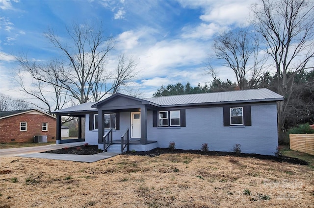 single story home featuring cooling unit