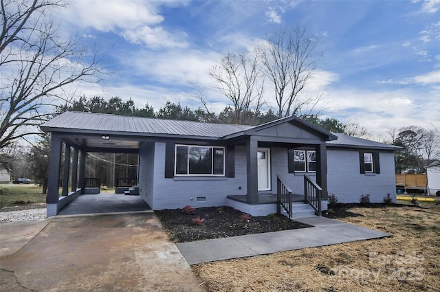 ranch-style home featuring a carport