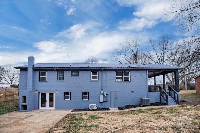 back of house with central AC and a patio area