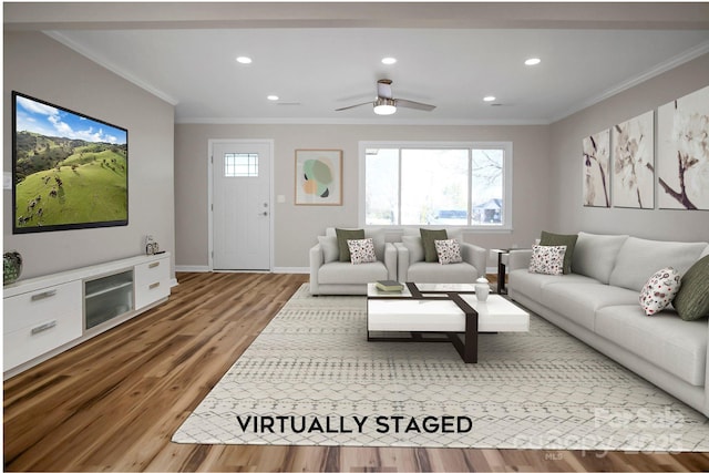 living room with wood-type flooring, plenty of natural light, crown molding, and ceiling fan