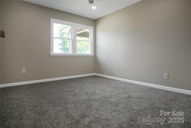 carpeted empty room featuring ceiling fan