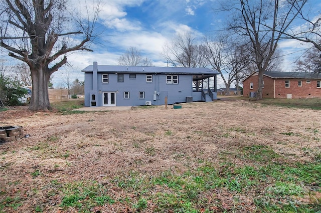 rear view of property with central air condition unit