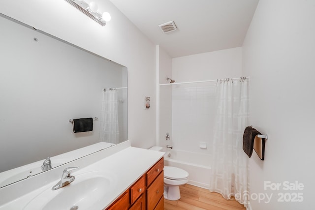 full bathroom with shower / bath combination with curtain, toilet, wood-type flooring, and vanity