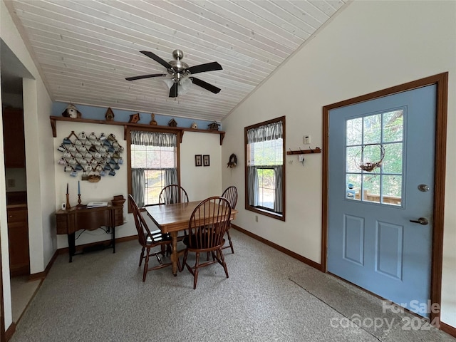 dining room featuring wooden ceiling, vaulted ceiling, ceiling fan, a healthy amount of sunlight, and carpet floors