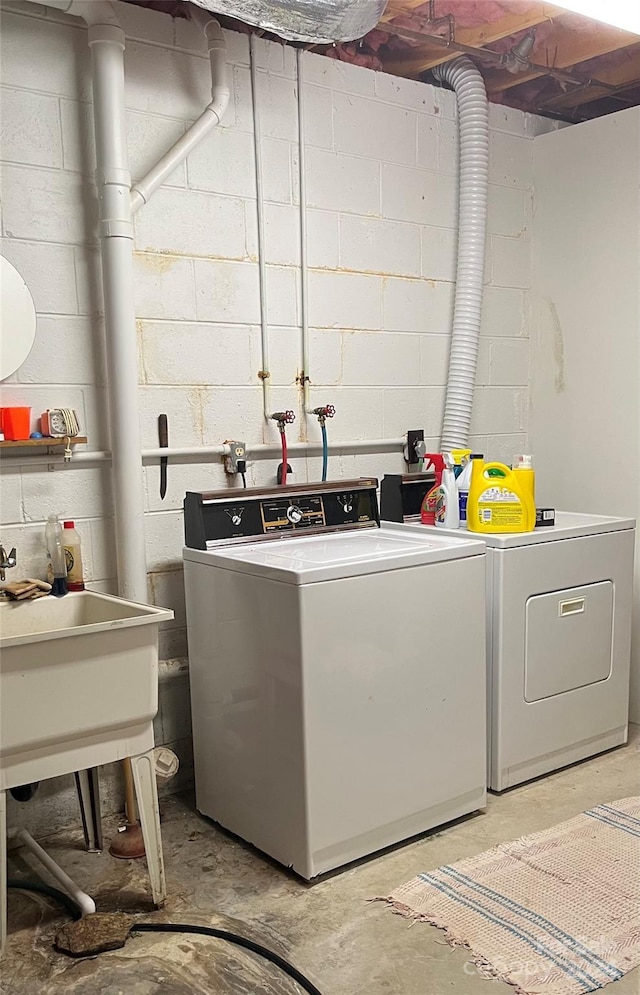 laundry area featuring washing machine and clothes dryer