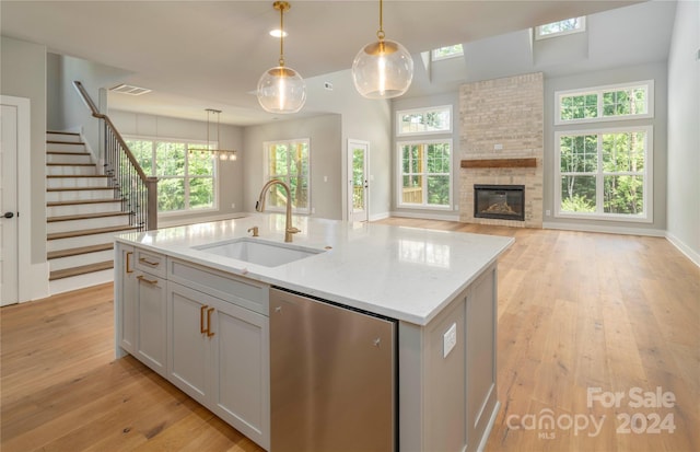 kitchen with plenty of natural light, sink, and hanging light fixtures