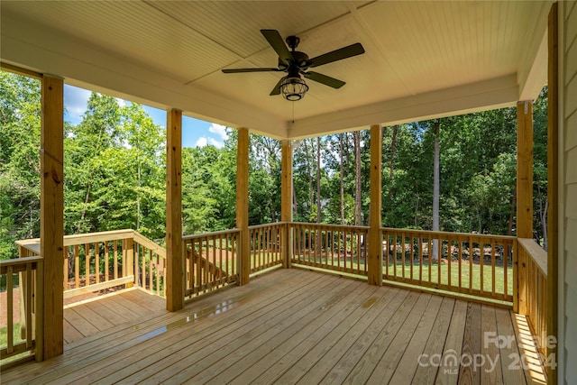 wooden terrace featuring ceiling fan