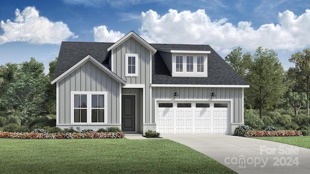 view of front facade with a front yard and a garage