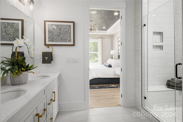 bathroom featuring vanity, hardwood / wood-style flooring, and an enclosed shower