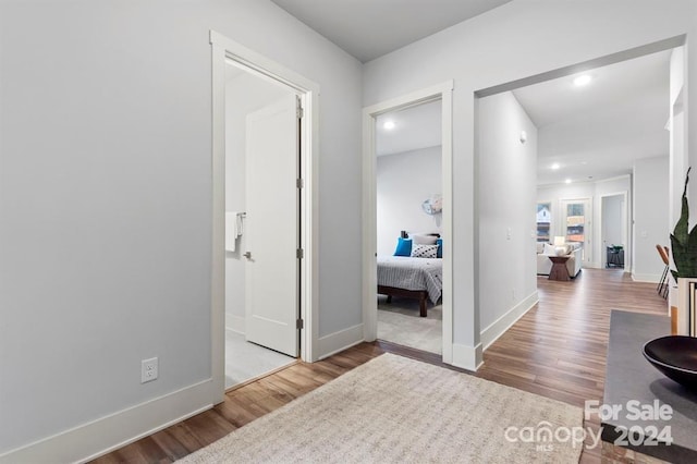 hallway featuring hardwood / wood-style flooring