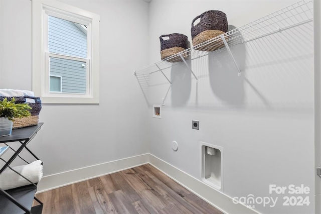 clothes washing area featuring washer hookup, electric dryer hookup, hookup for a gas dryer, and wood-type flooring