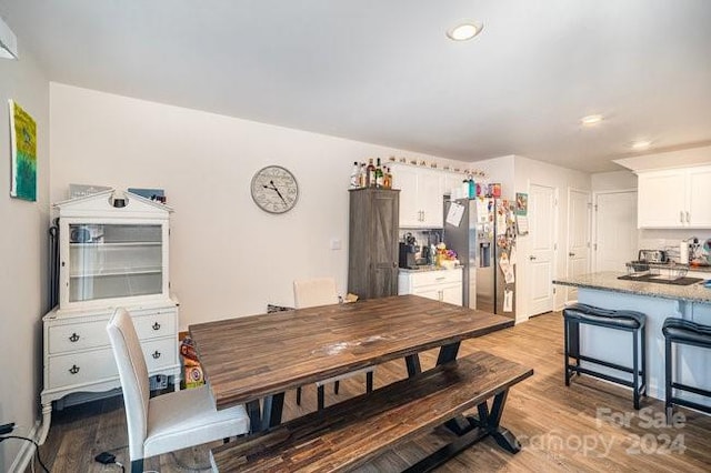 dining room with light hardwood / wood-style flooring