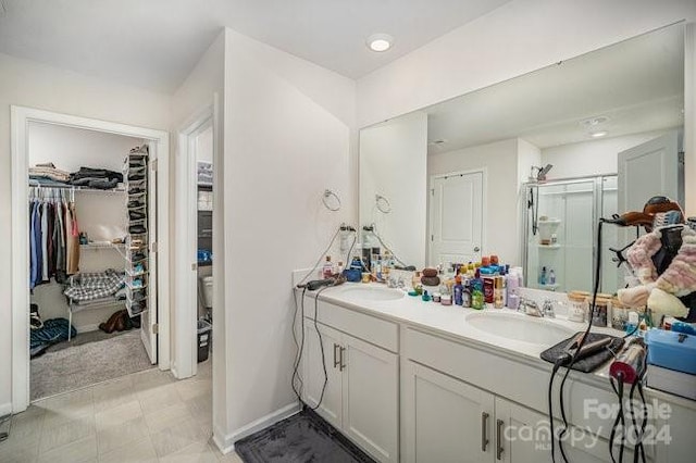 bathroom with vanity, a shower with shower door, and toilet