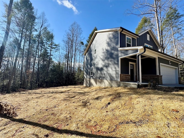 exterior space featuring covered porch and a garage