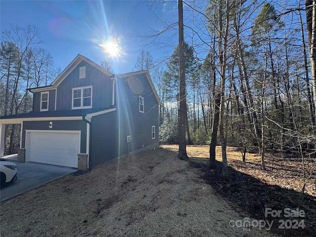 view of side of home with a garage