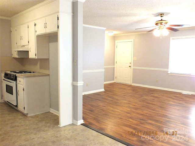 kitchen featuring light wood-type flooring, white range, white cabinetry, and ornamental molding