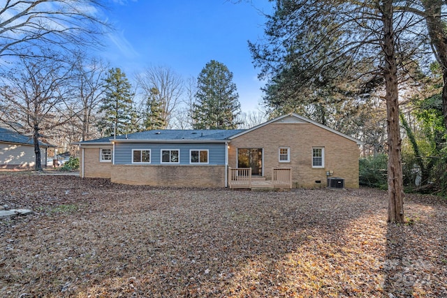 back of property with central air condition unit and a wooden deck