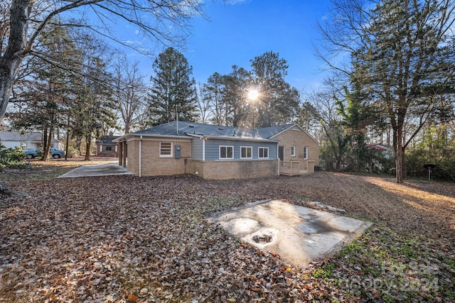 rear view of house featuring a patio