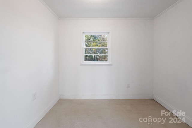 unfurnished room featuring ornamental molding