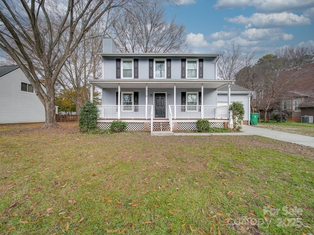 view of front facade featuring cooling unit, covered porch, and a front yard